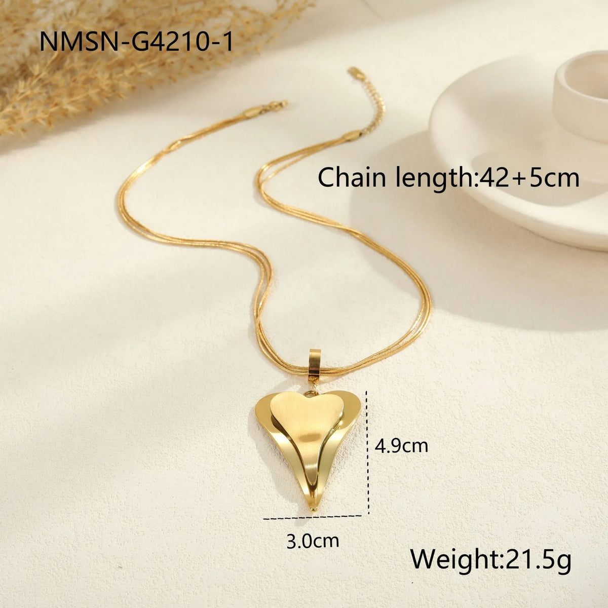 Women's stainless steel necklace with double heart geometric pendant featuring snake bones design in gold plating
