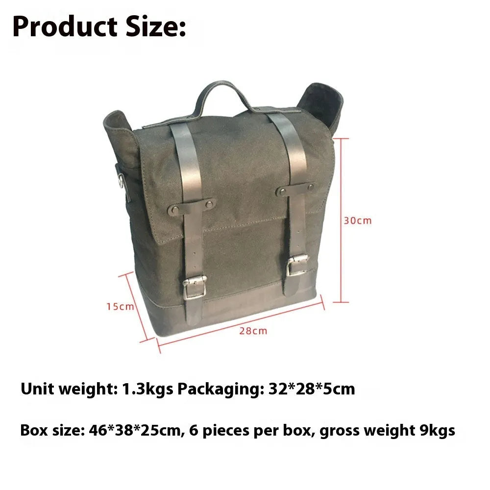 Motorcycle side pannier bag in black made from waterproof canvas with cowhide trim.
