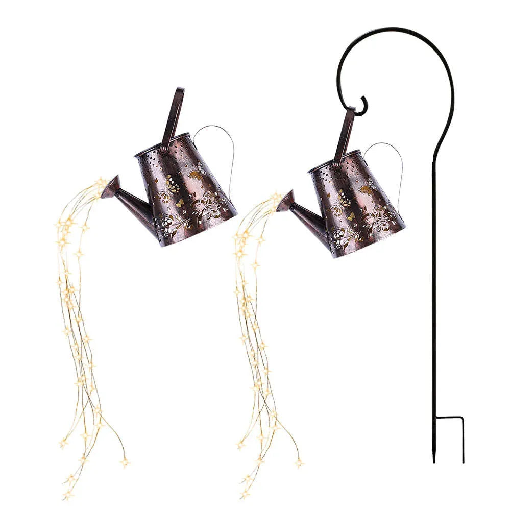 Tapered iron solar garden lamp with butterfly pattern emitting warm white light in a courtyard setting