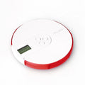 Blue 7-compartment alarm clock pill dispenser showing timer display and weekly medicine slots
