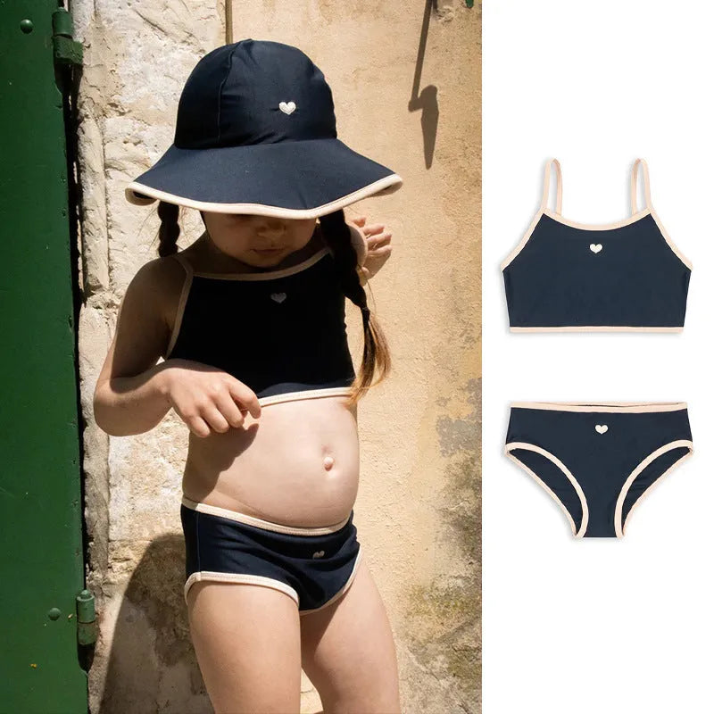 Dark blue split-style briefs swimsuit for baby girls, shown in sizes from 90cm to 130cm.
