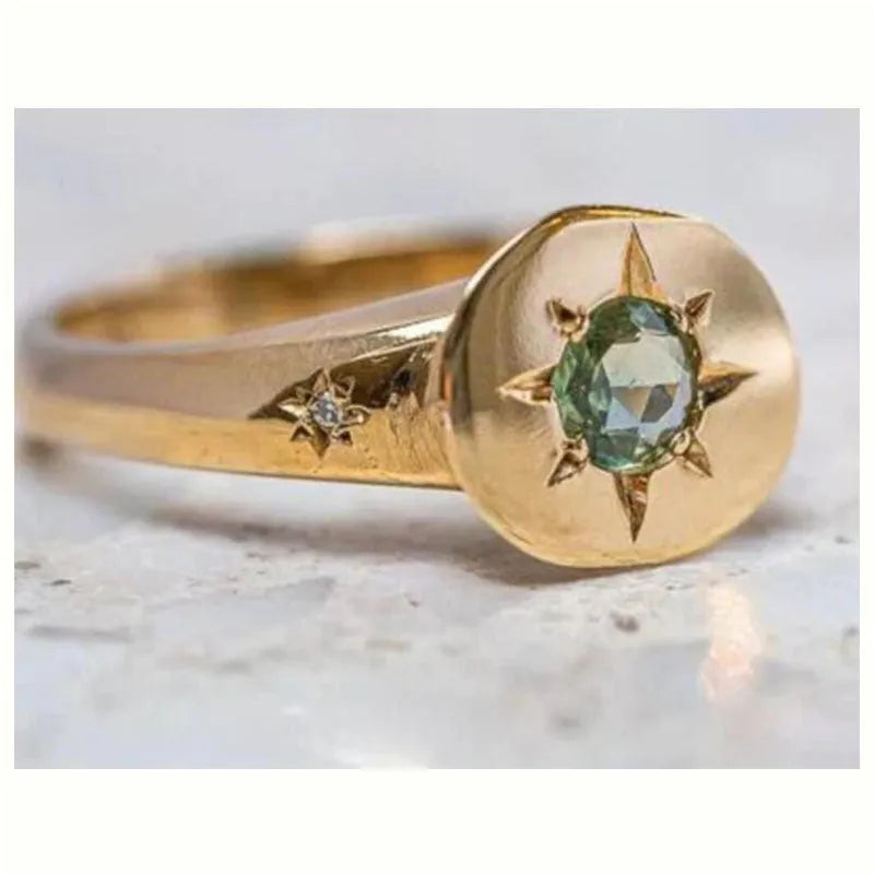 Gold zinc alloy ring with oval asterism zircon star and adjustable opening