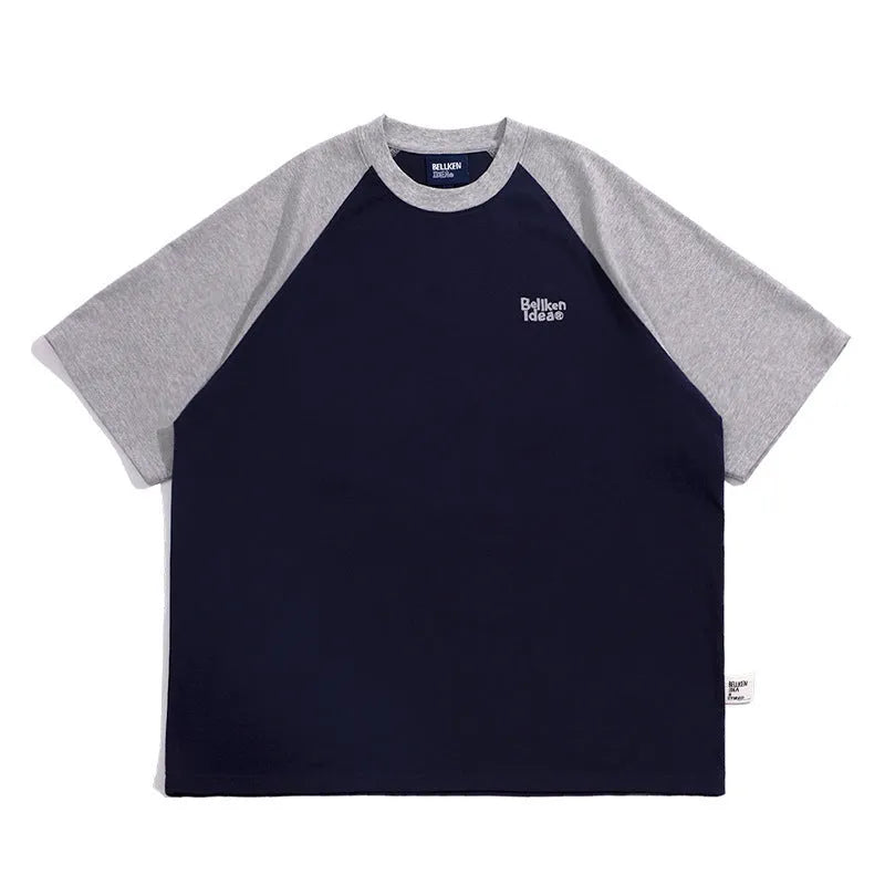 Men's blue loose-fit casual t-shirt with raglan sleeves on a hanger.