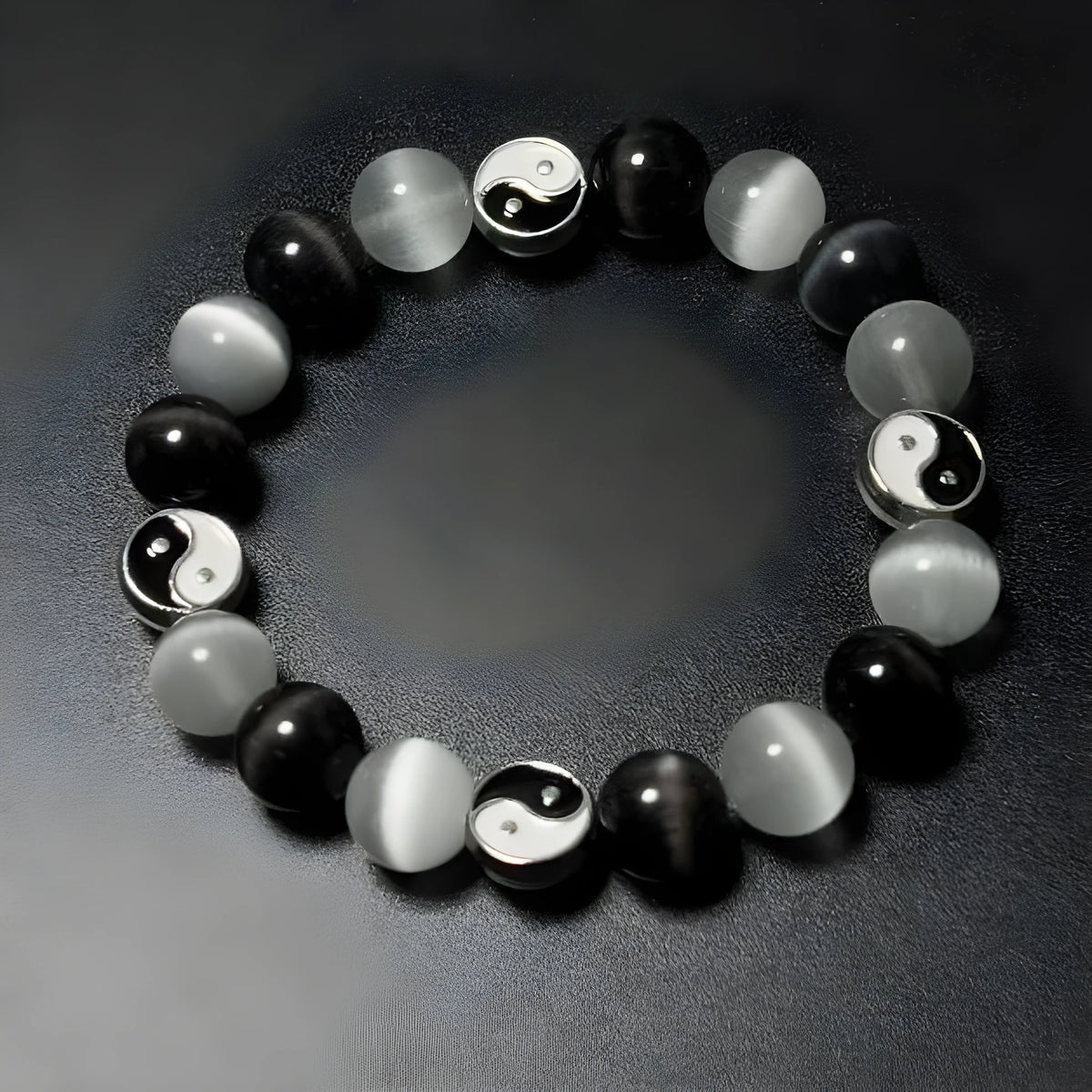 Close-up of a natural opal Tai Chi beaded bracelet with 10mm polished stones on a wrist.