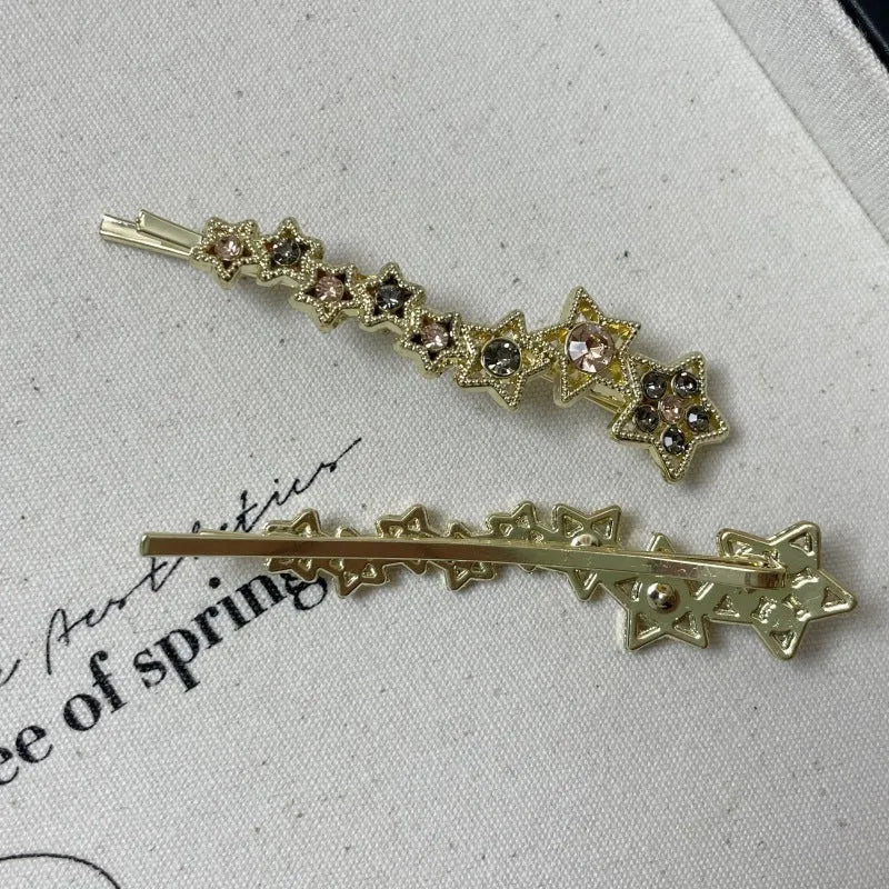 Gold electroplated hair barrette with star decoration and side clip design for bangs