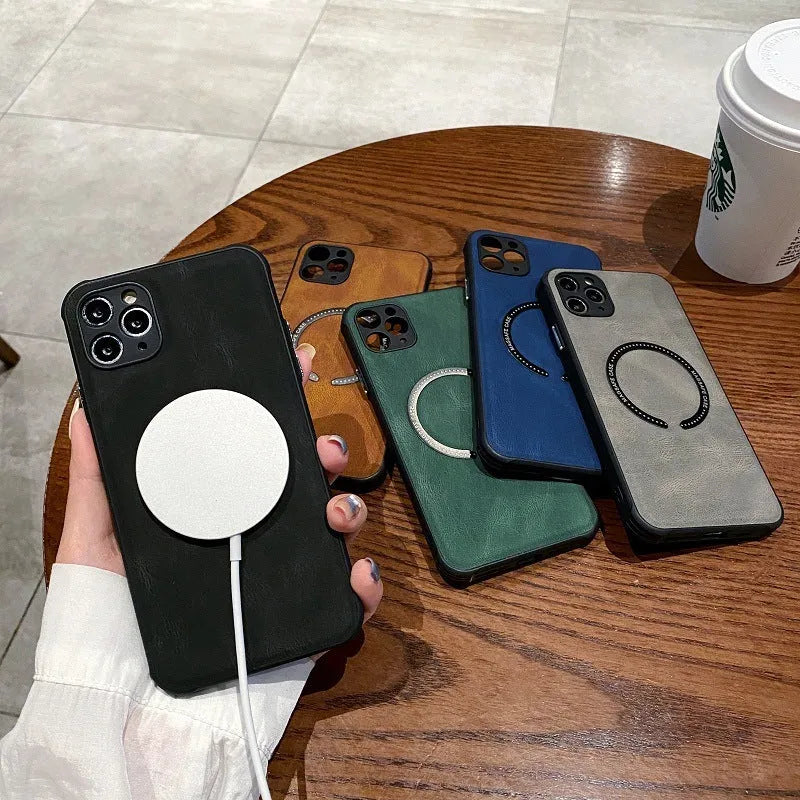 Black imitation leather magnetic charging case for Apple iPhone on a wireless charger.