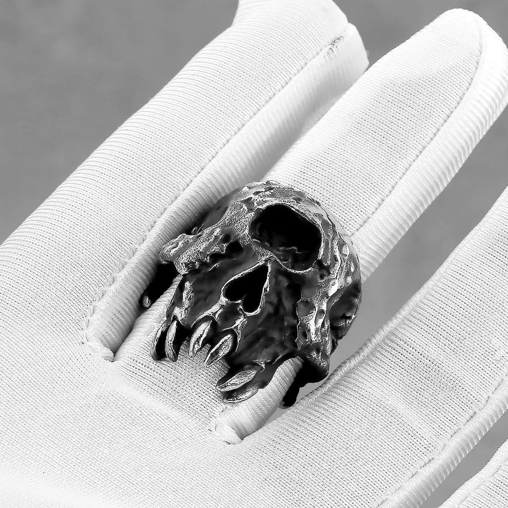 Silver alloy one-eyed skull ring with electroplated finish available in sizes 7 to 13