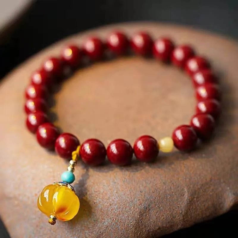 Handcrafted wave-shaped bracelet made from cinnabar and copper beads in national style