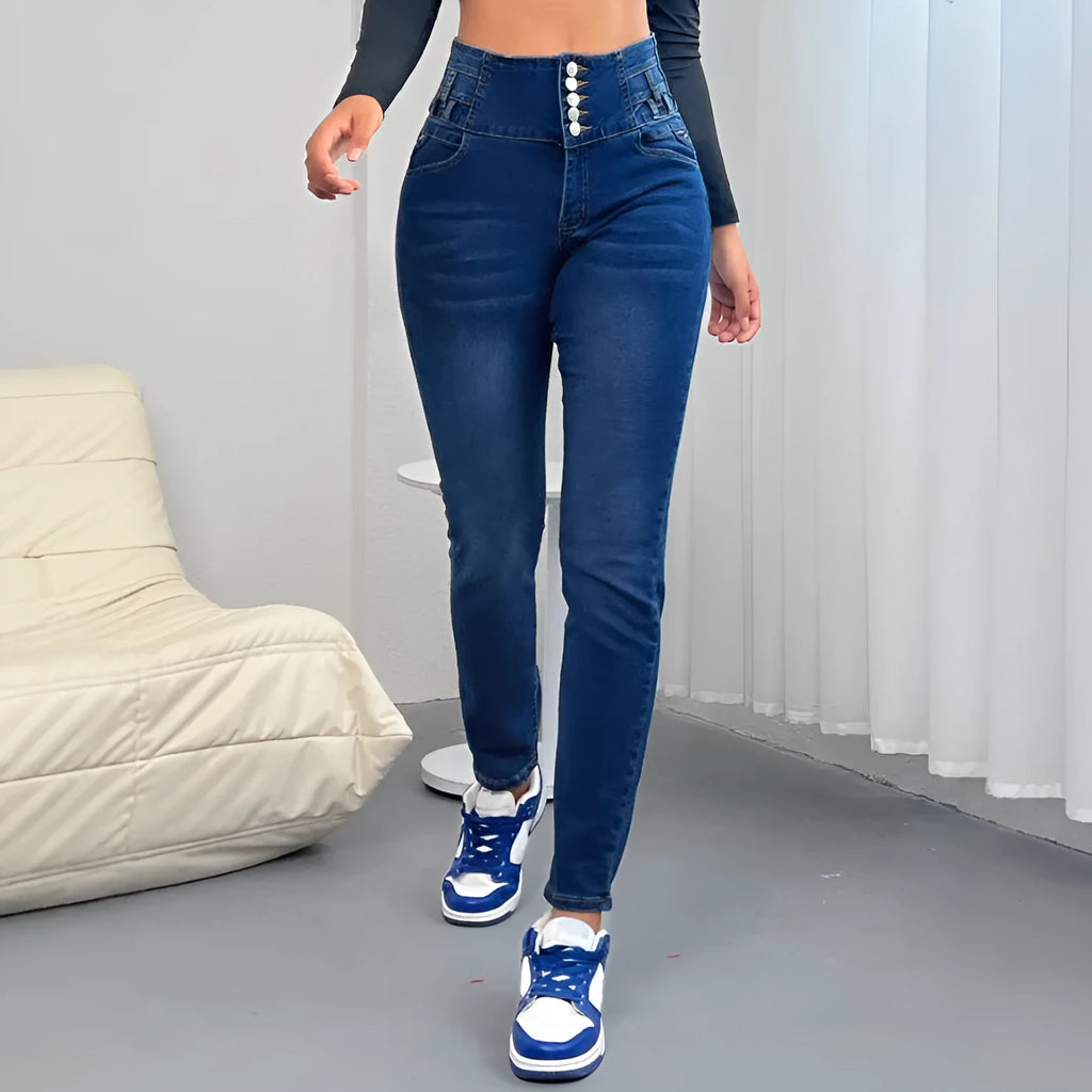 Dark blue women's denim trousers with a breasted waistband and straight-leg skinny fit.