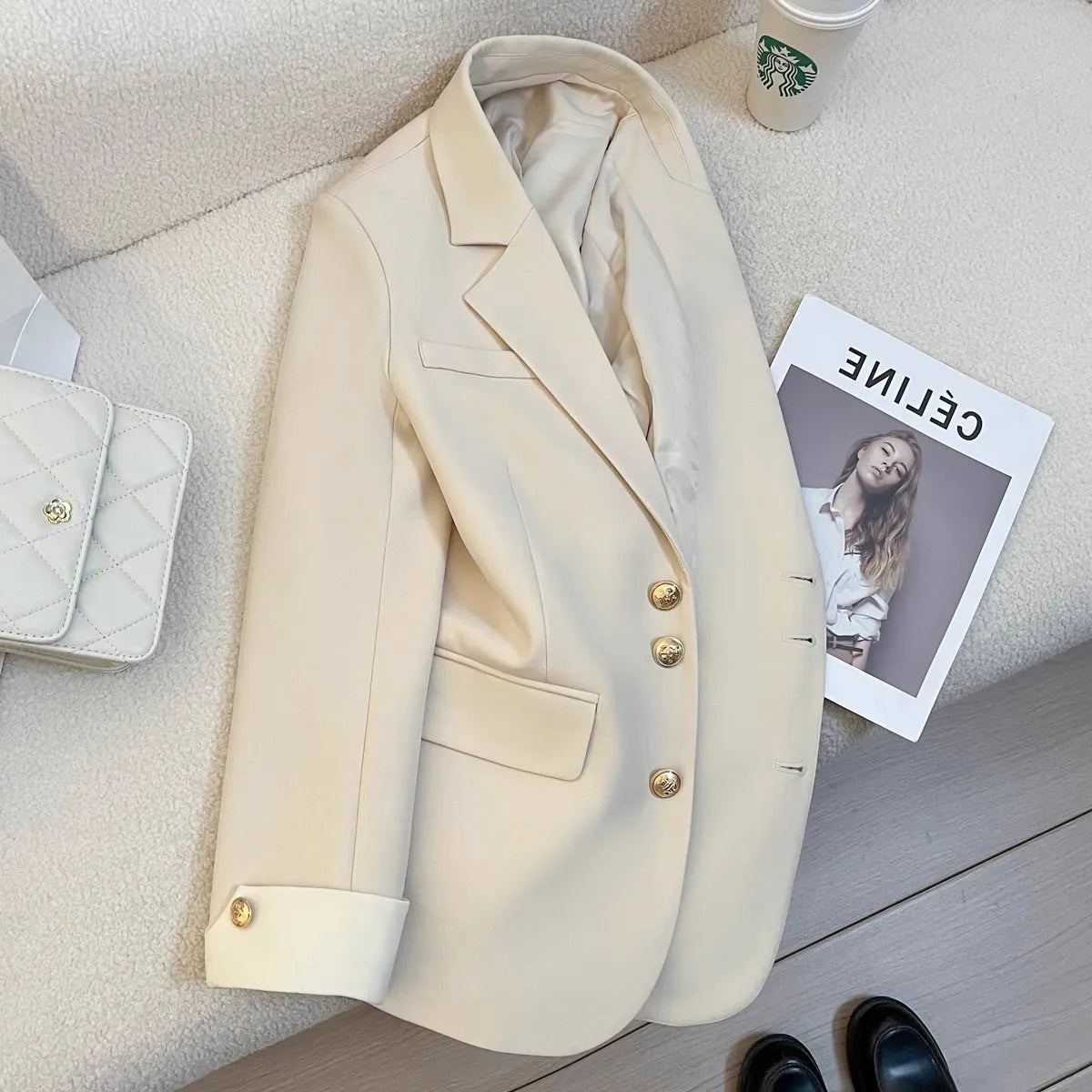 Korean style women's loose fit coat in milky white or black polyester with long sleeves and pockets
