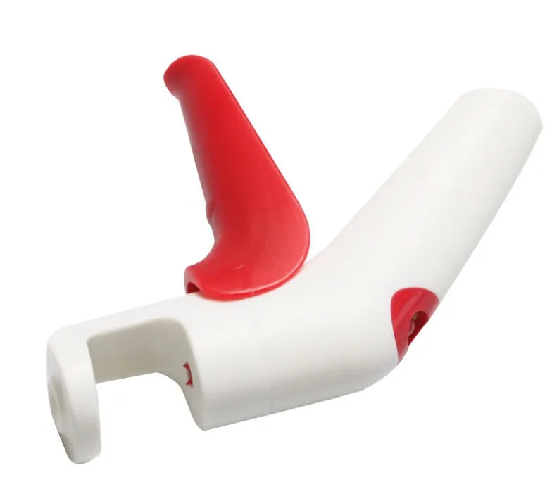 Stainless steel cherry kernel remover kitchen tool with red plunger and ergonomic handle.