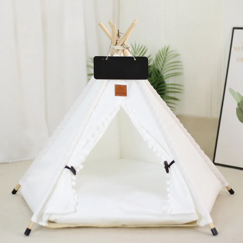 White striped pet teepee tent bed with cushion for a small dog indoors