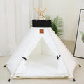 White striped pet teepee tent bed with cushion for a small dog indoors