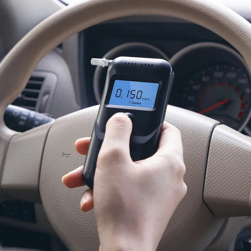 Black household alcohol tester for breath analysis and driving checks