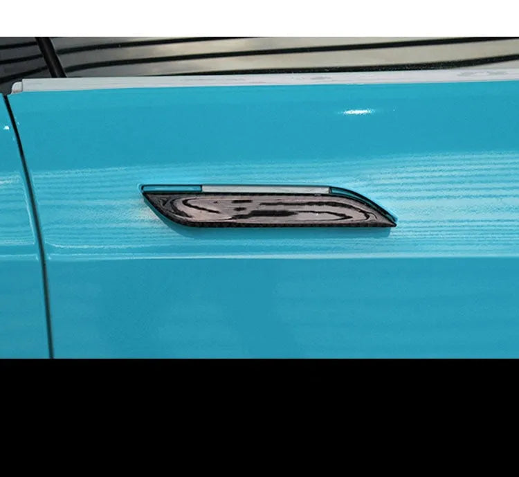 Four carbon fibre adhesive door handle protection patches for Tesla Model S with drip texture finish