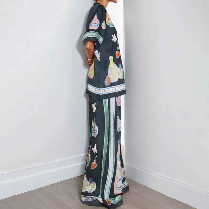 Women's black cardigan set with cartoon pattern, includes top and trousers