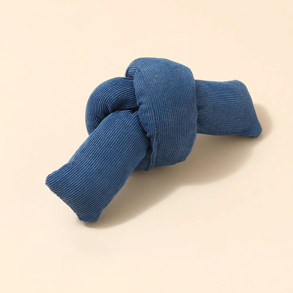 White knotted cotton dog rope toy for tugging and chewing.