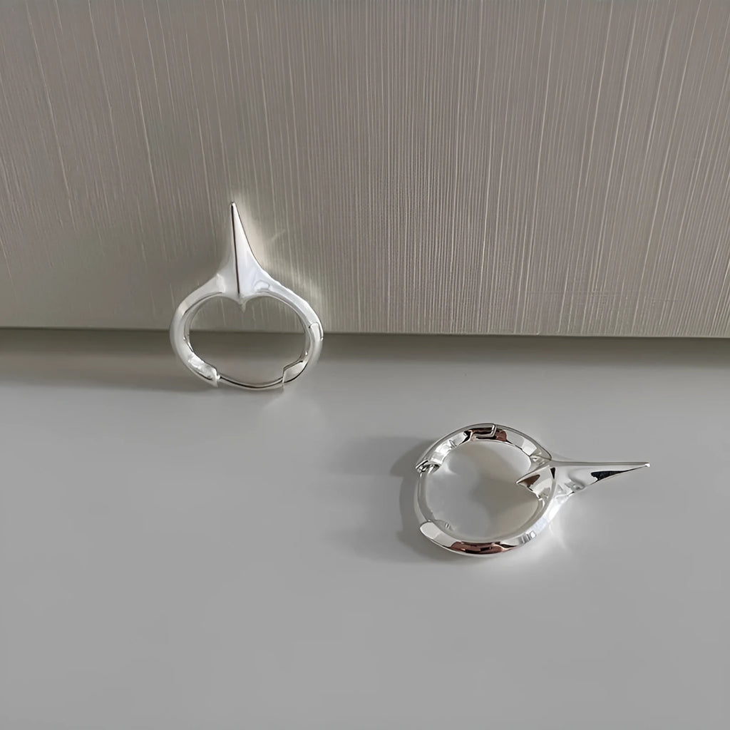Geometric star-shaped ear clips for women with electroplated platinum finish on copper