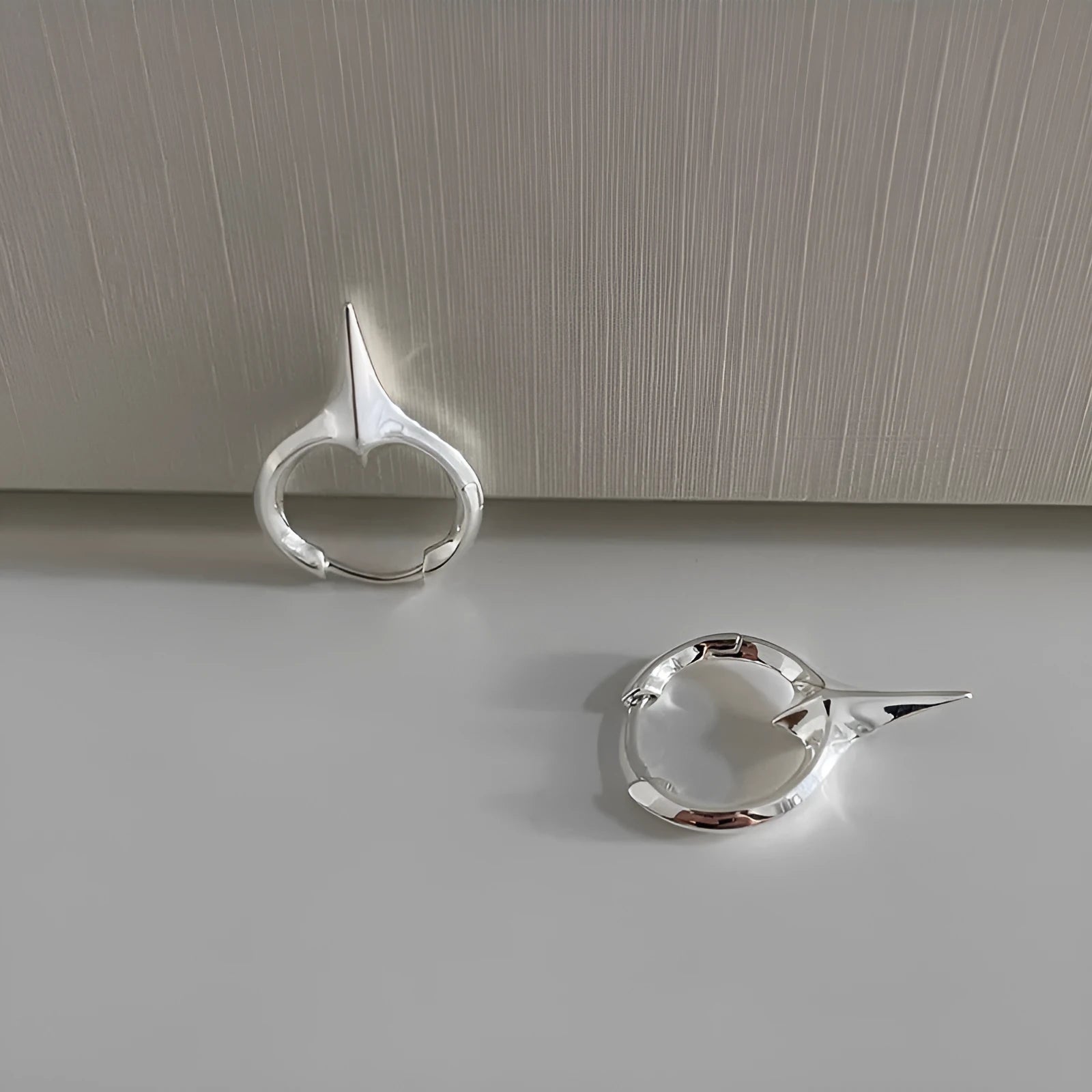 Geometric star-shaped ear clips for women with electroplated platinum finish on copper