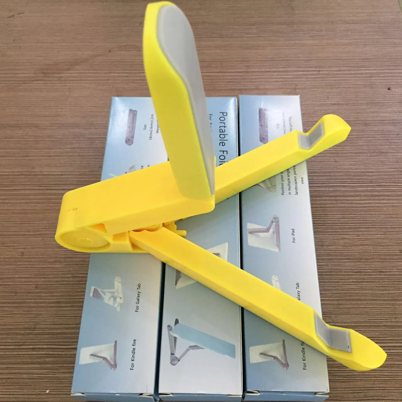 Black foldable aluminium tablet holder showing adjustable angles and flat-folded profile