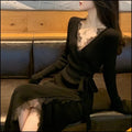 Black women's slim fit A-line woolen skirt, polyester princess dress on hanger.