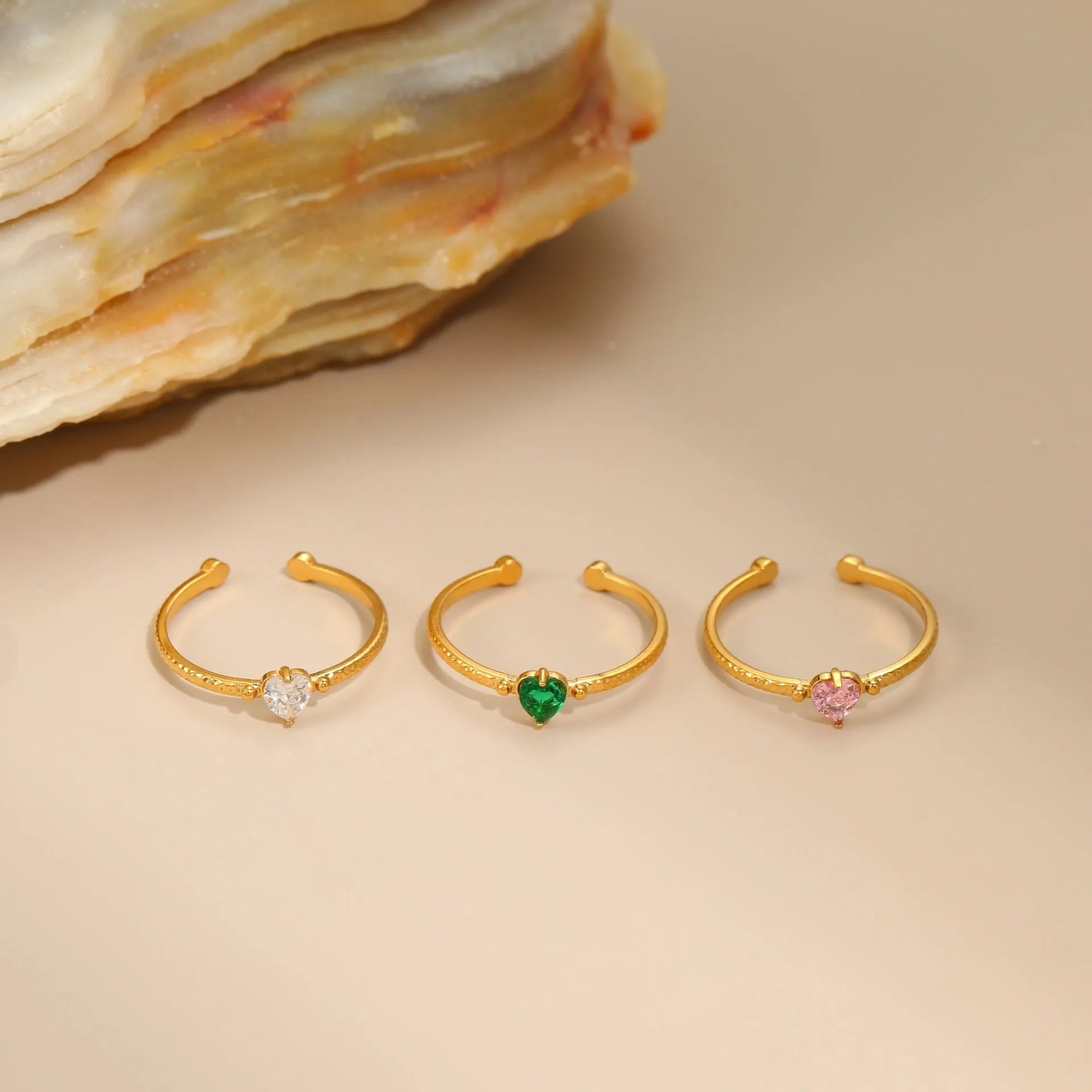 Open-ended heart-shaped ring with geometric design and zircon inlay in stainless steel