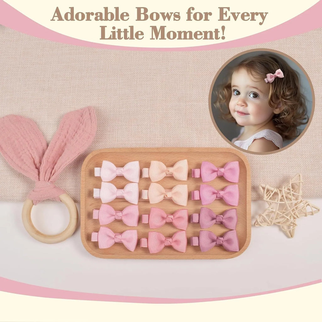Set of pastel-coloured baby hair clips and bows arranged in rows, showing variety of colours.