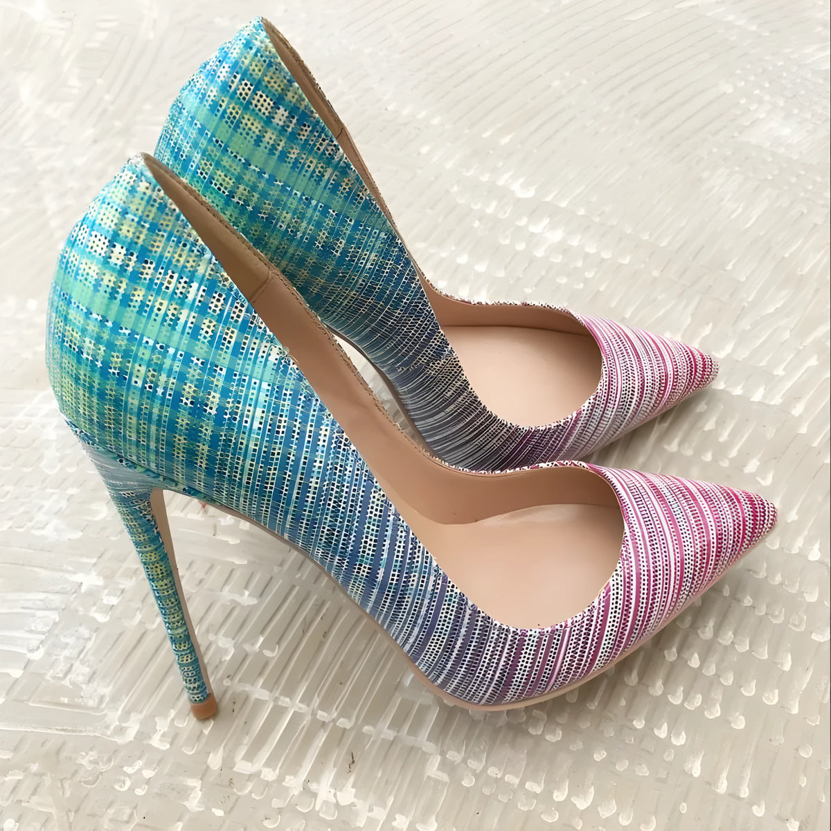 Ladies' pointed toe high heels with pink to blue gradient patent leather and a high heel.