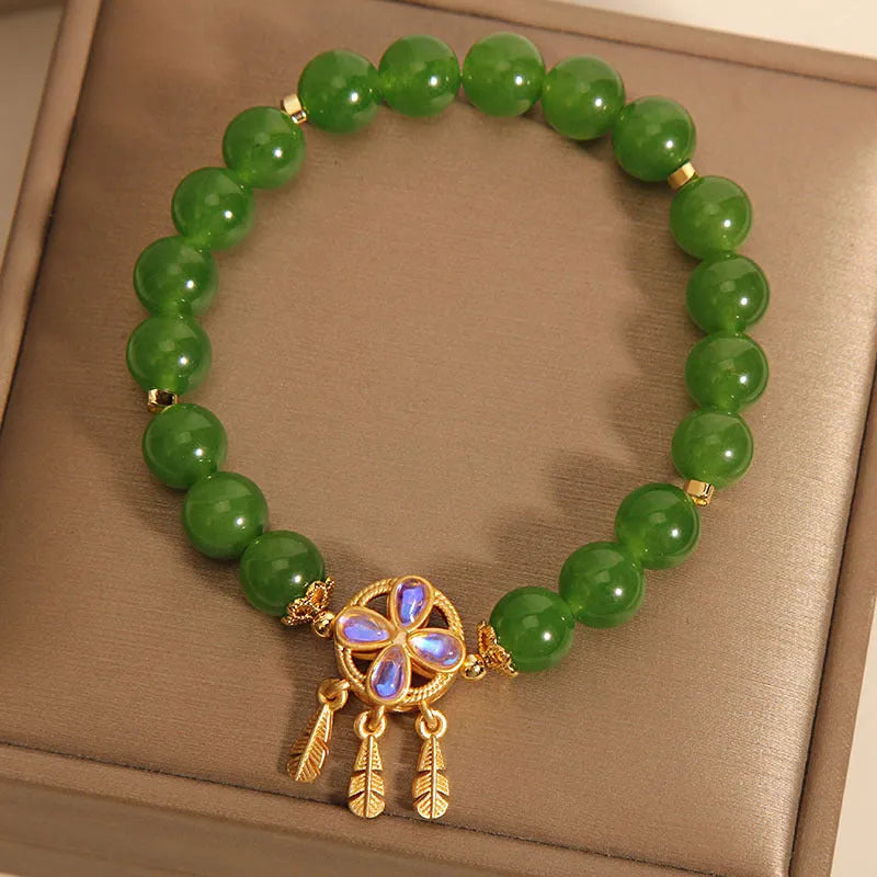 Green jasper crystal bracelet with four-leaf clover dream catcher pendant for women.