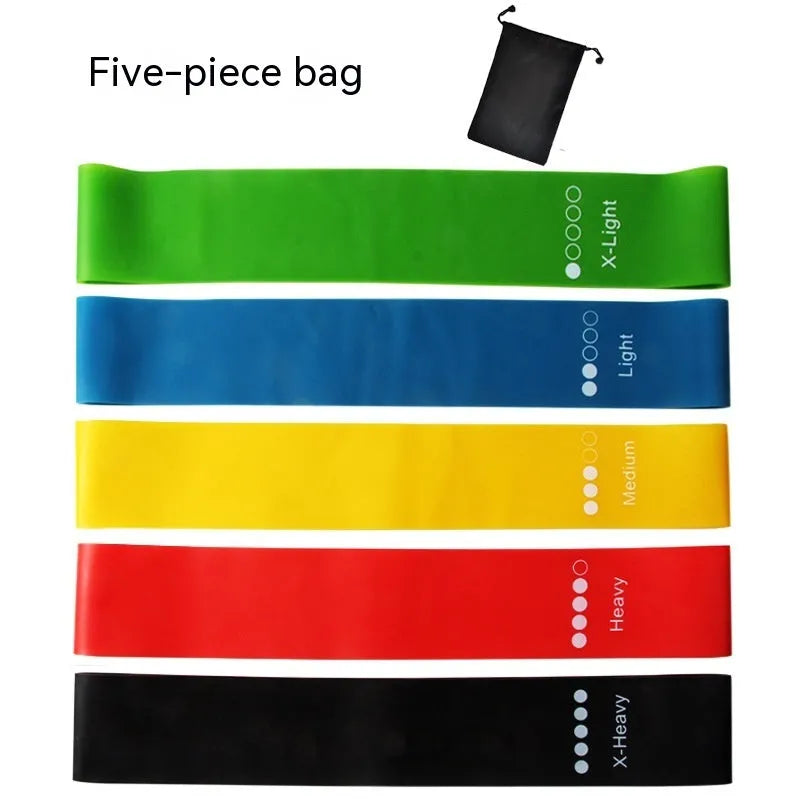 Set of five colour-coded TPE yoga tension straps laid out side by side, showing green, blue, yellow, red, and black options.