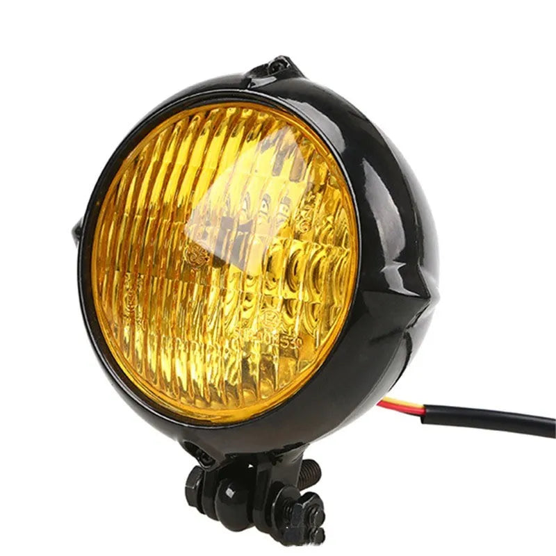 Black electroplated aluminium motorcycle headlight with halogen bulb for classic custom bike builds.