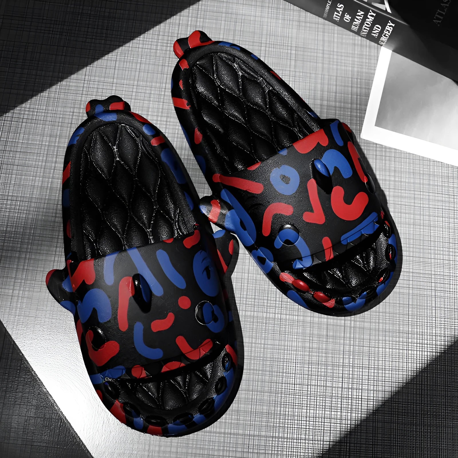 Shark design open-toe home slippers in EVA material on a white background.
