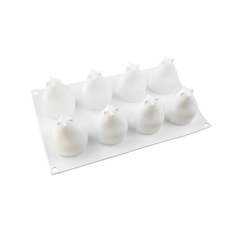 Set of six silicone baking moulds showing pineapple, pine cone and pear shapes for dessert making