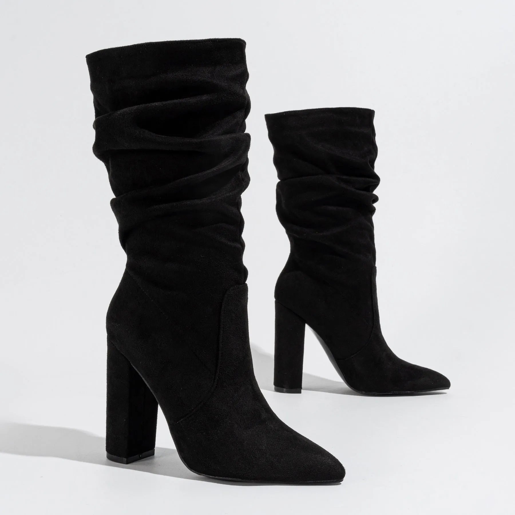 Women's black suede chunky heel pointed toe pull-on boots with mid-calf shaft.