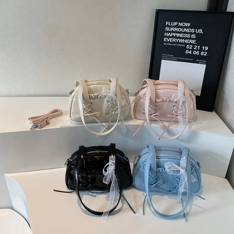 Ladies casual shoulder bag with bandage bow detail and internal mobile phone compartment