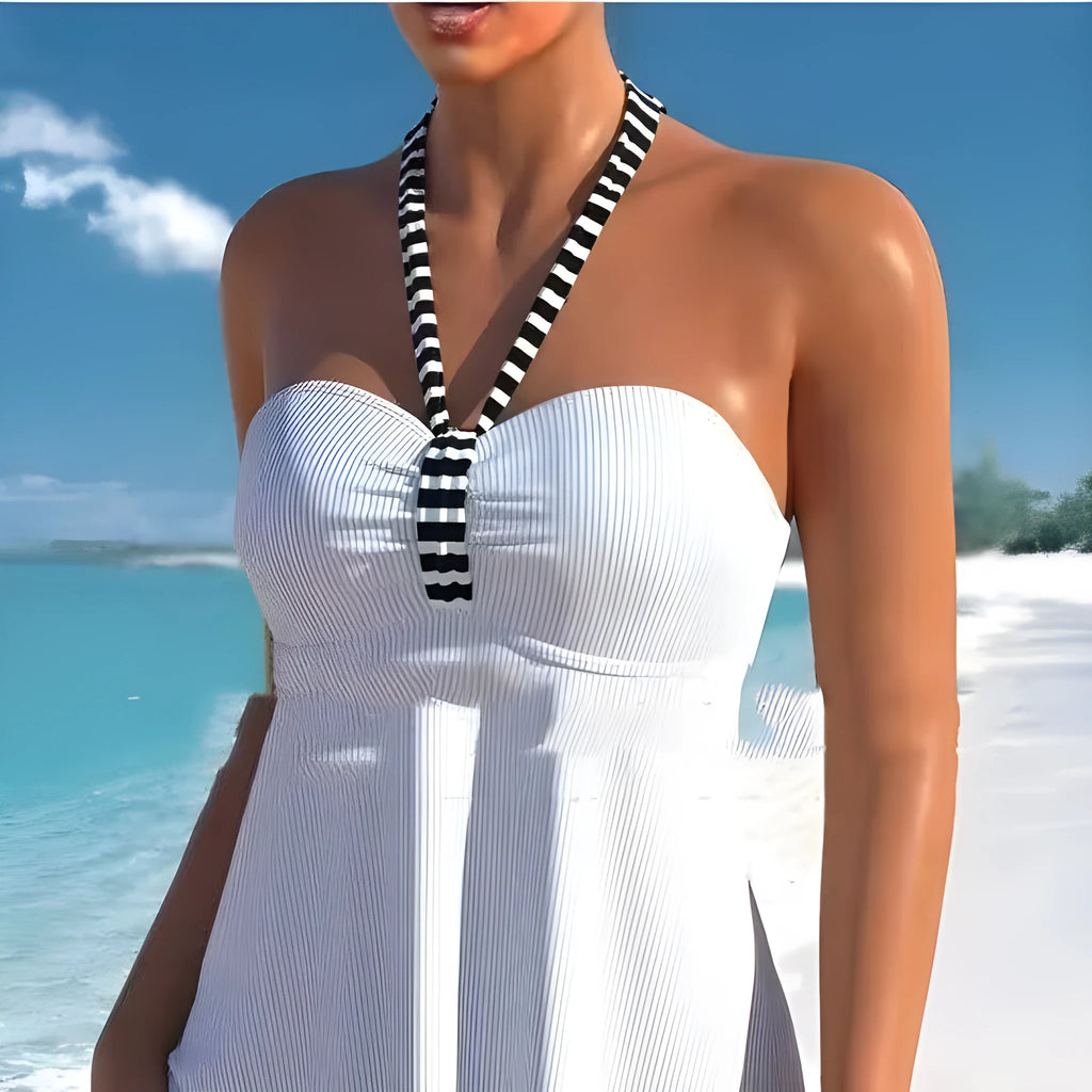 Black and white striped off-shoulder one-piece swimsuit with briefs style bottom.