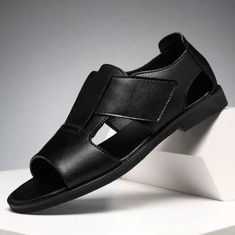 Men's black leather Roman sandals with open-toe design and rubber soles.