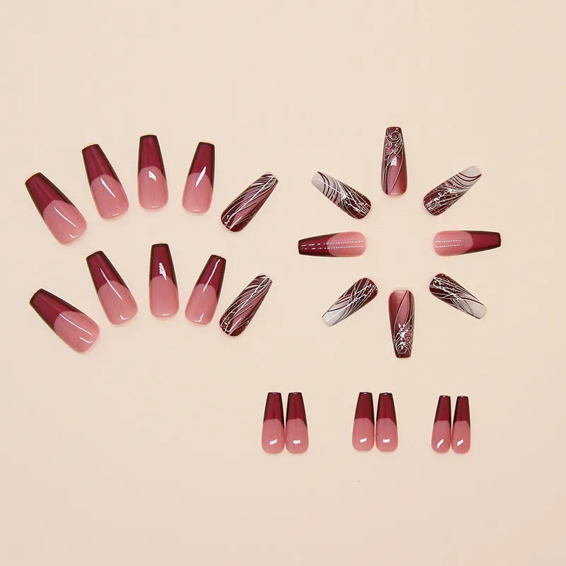 French line pattern fake nails with removable adhesive on plastic backing next to glue tube