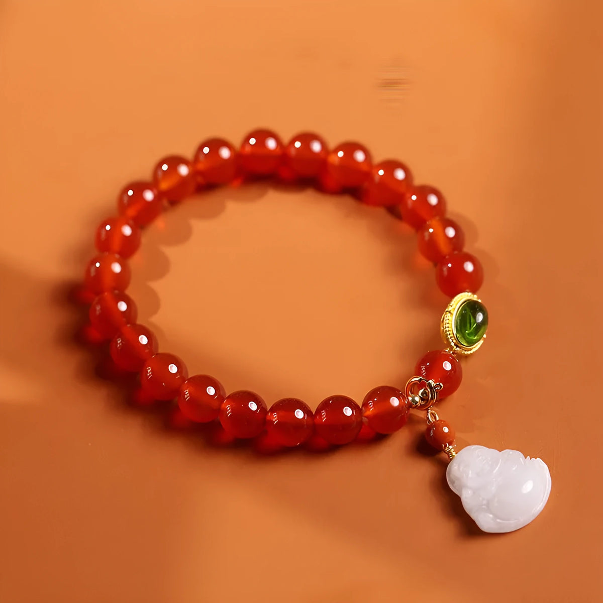 Handcrafted natural agate bracelet with red beads, amber geometric elements, and Maitreya Buddha charm