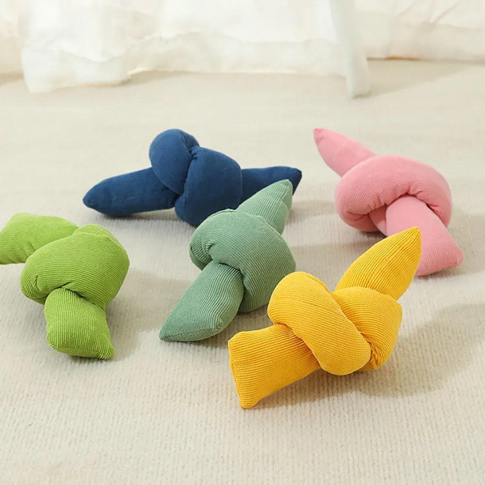 White knotted cotton dog rope toy for tugging and chewing.