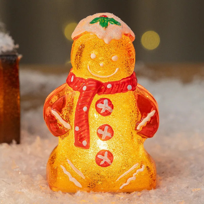 Glowing gingerbread man snowman Christmas ornament with LED lights in plastic construction