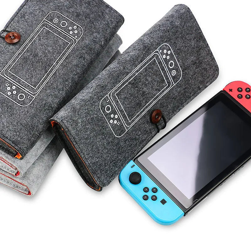 Black Nintendo Switch felt pouch case open, showing console slot and 5-game card holder.