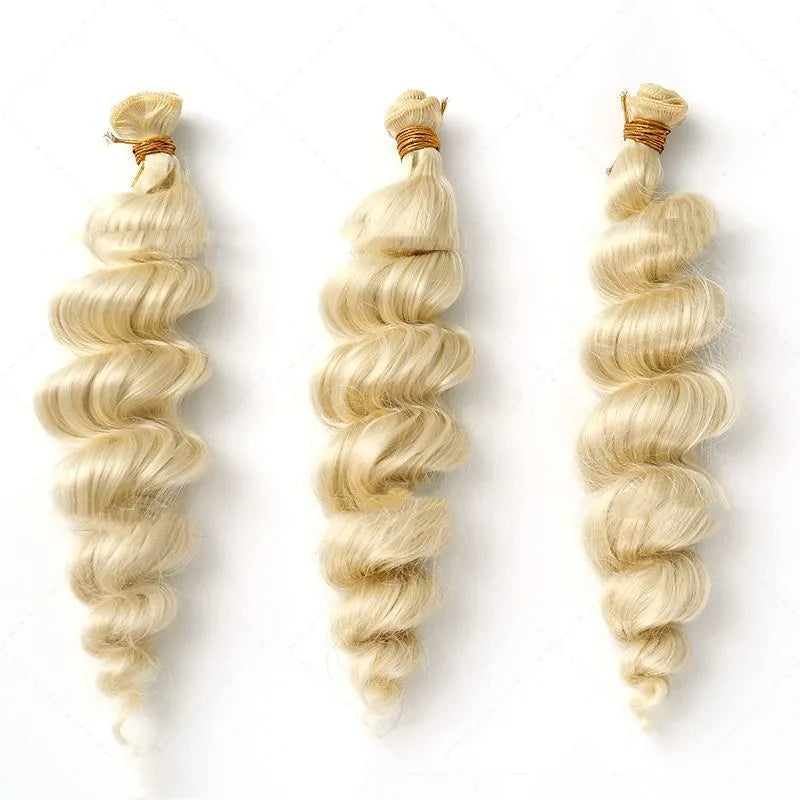 Golden coloured synthetic hair weft wig for women on a stand.