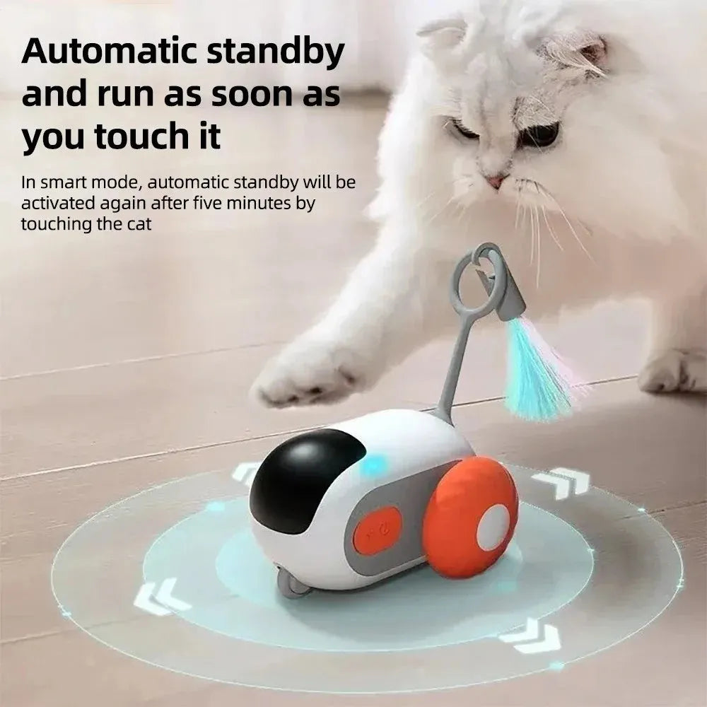 Blue remote-controlled cat toy car with feather attachment on orange background