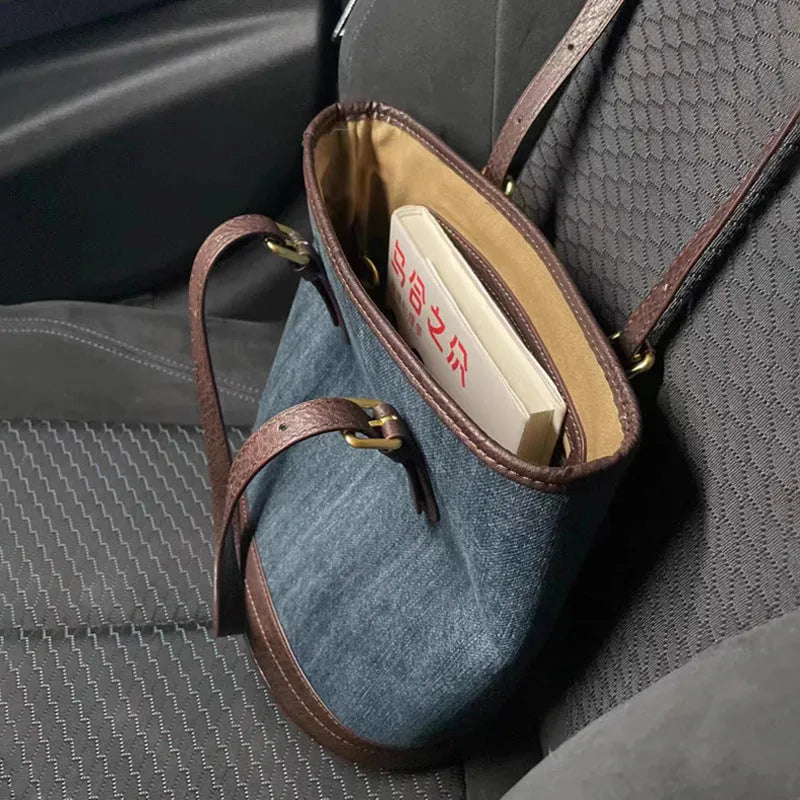 Retro denim patchwork one-shoulder bucket handbag showing large capacity interior