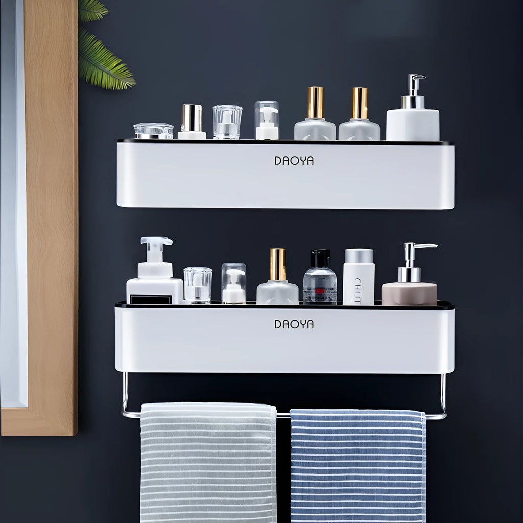 Black plastic wall-mounted bathroom shelf with adhesive installation holding shampoo and cosmetics