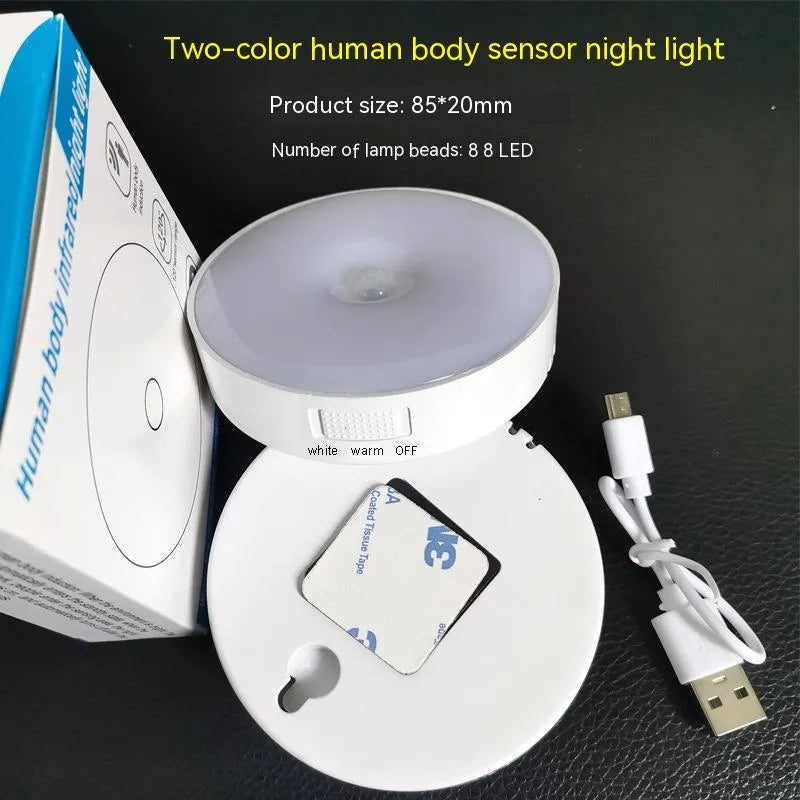 Small round beige or white LED night light with motion sensor and USB charging port