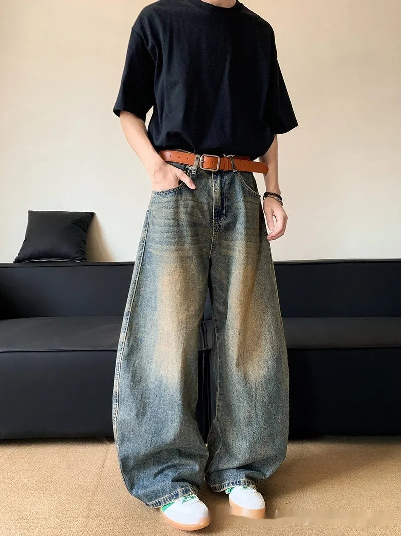 Men's retro blue distressed denim jeans with wide-leg trouser design and micro-elastic fabric
