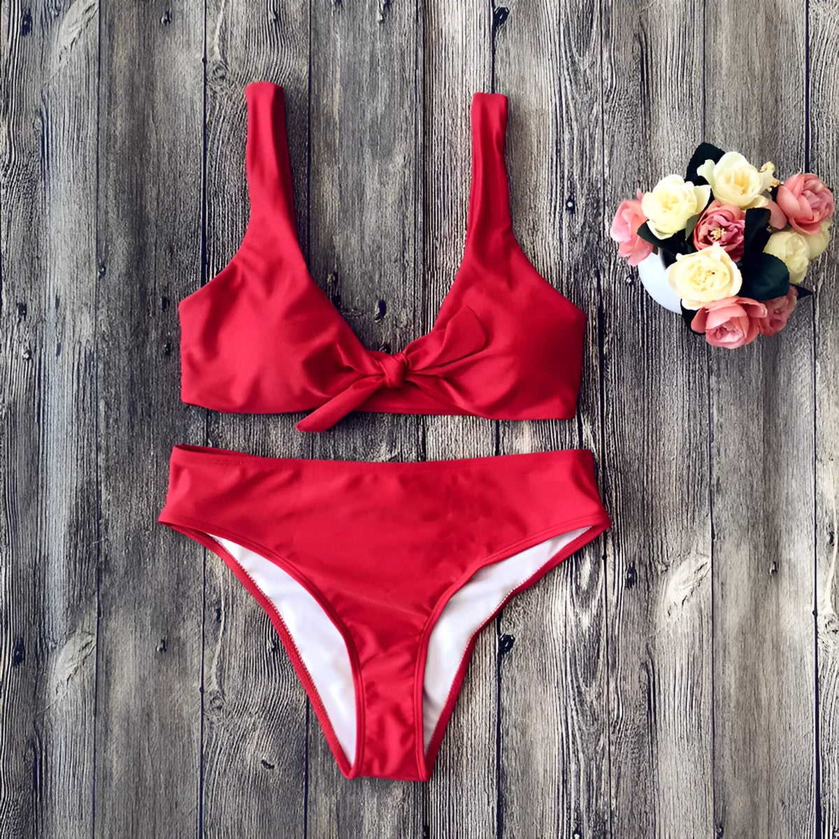 Women's solid colour bikini swimsuit set in polyester fabric, shown in black, pink, red, white, or wine red.