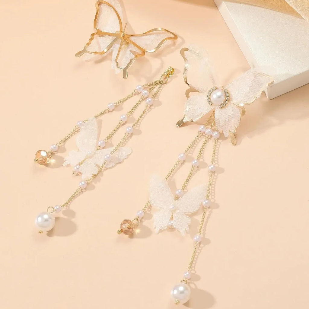 White butterfly earrings with rhinestone and pearl accents on copper alloy with lace tassels